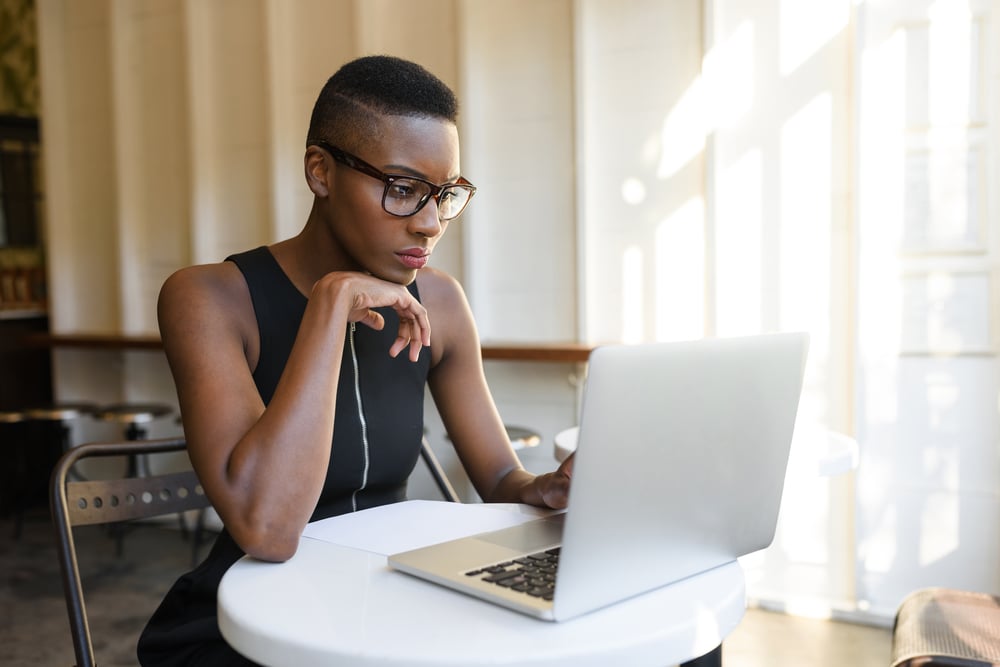 Young-fashionable-african-business-woman-working-overemployed