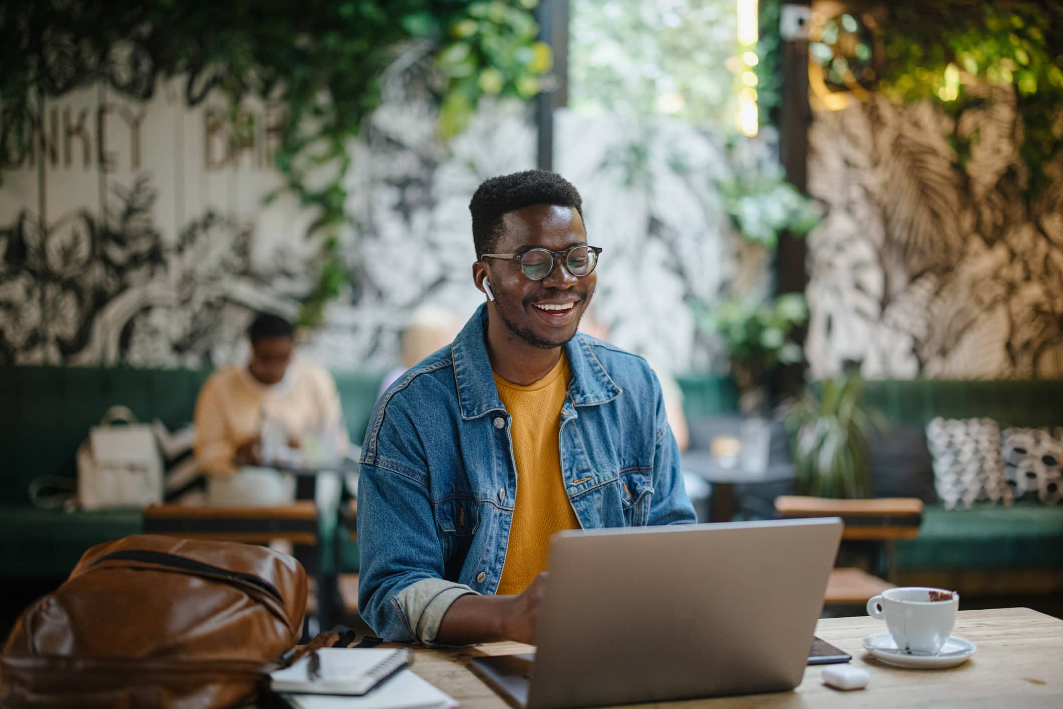 Young-man-on-a-video-call-in-a-cafe-how-to-be-content-with-life