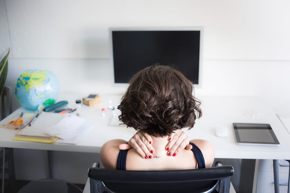 Young-woman-massaging-effects-of-workplace-stress