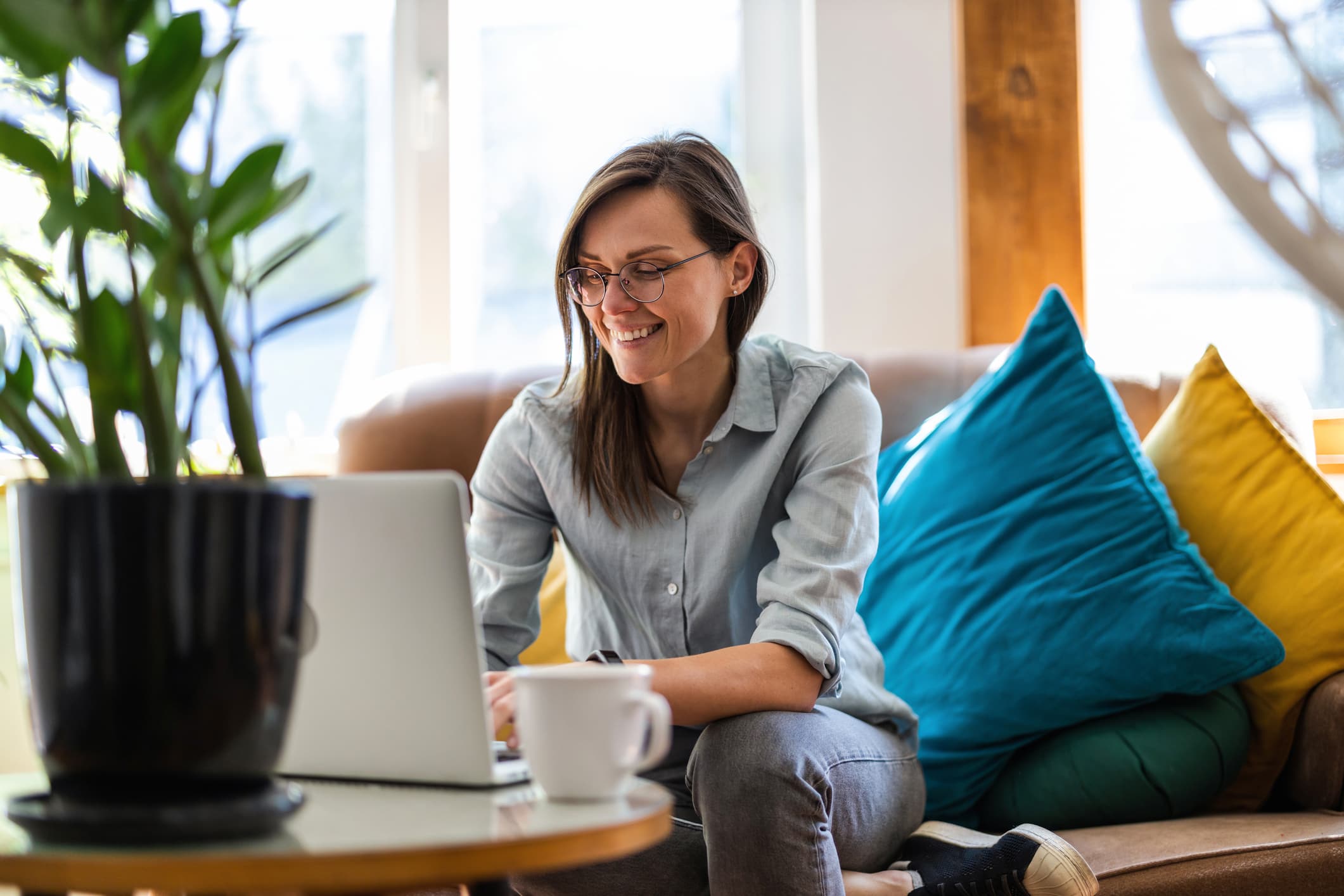 Young-woman-using-a-laptop-at-home-self-reflection