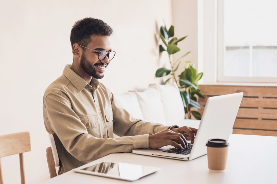 afro-man-working-and-smiling-how-to-get-over-embarrassment