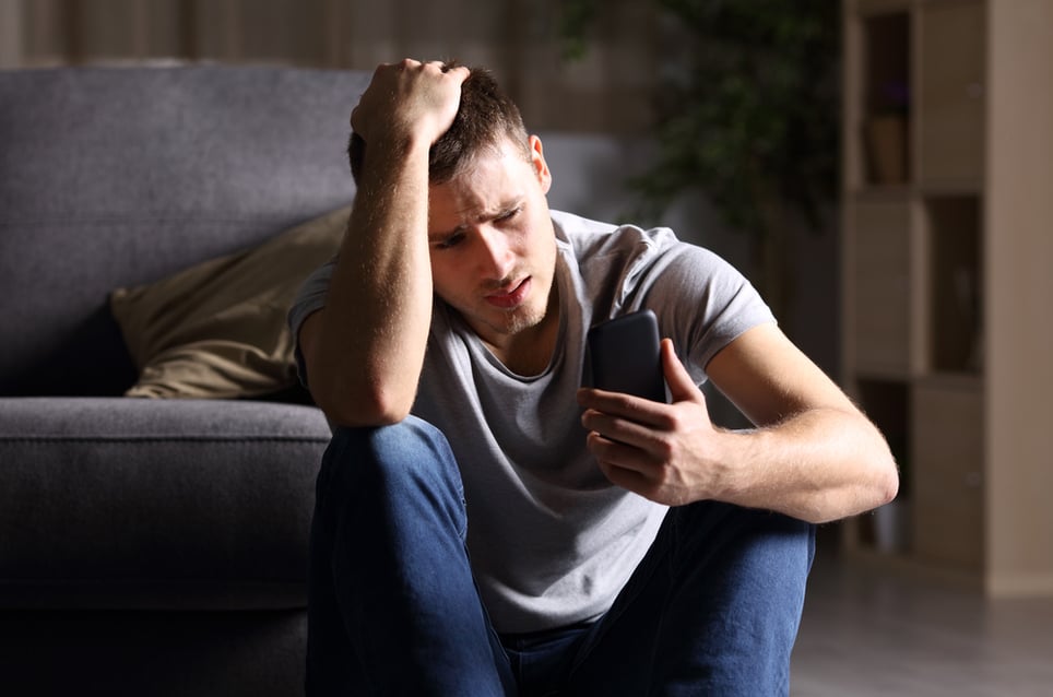 anxious-man-using-his-phone-effects-of-low-resiliencegydF4y2Ba