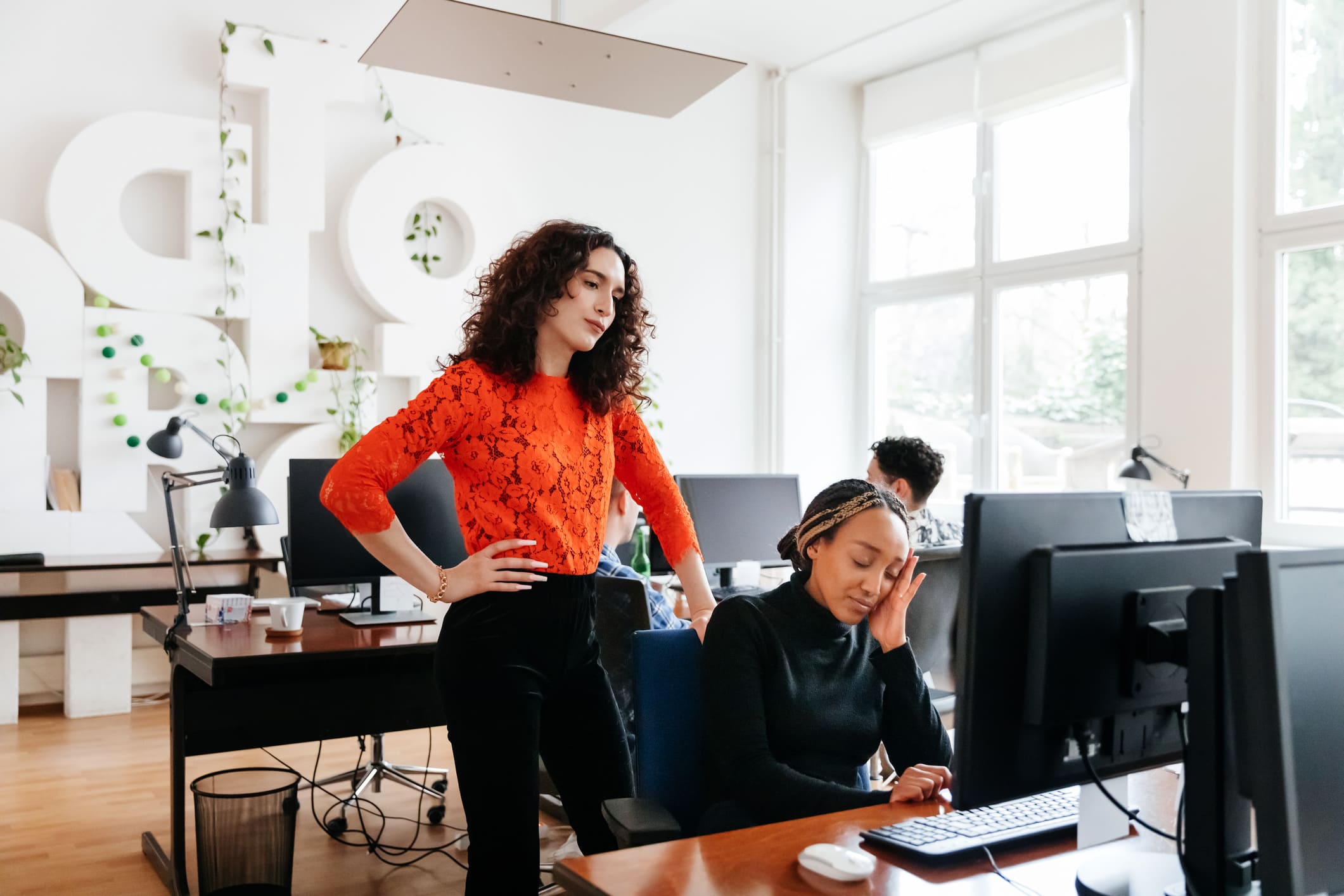 business-manager-overlooking-colleague-working-what-is-eustress