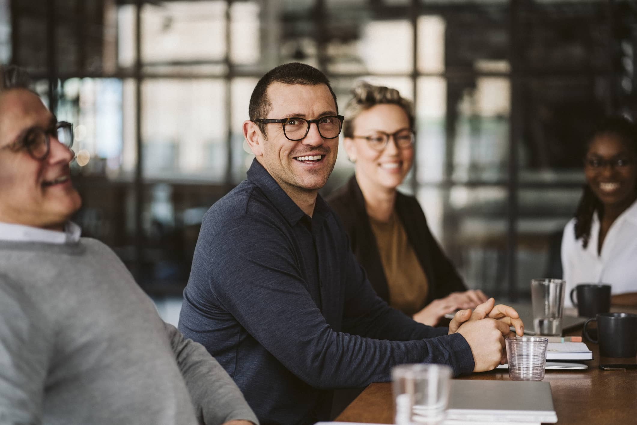 businessman-sitting-at-conference-table-motivation-vs-inspiration