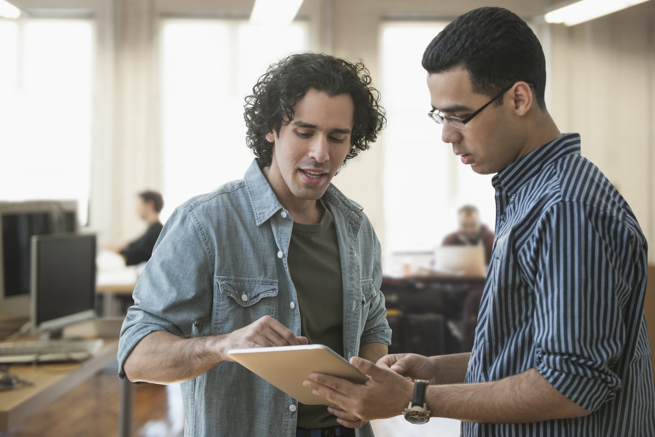 businessmen-using-digital-tablet-business-casual