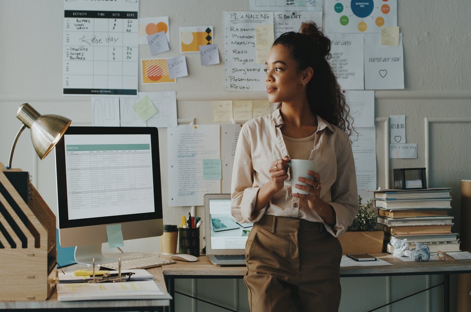 businesswoman-standing-with-her-cup-passed-over-for-promotion