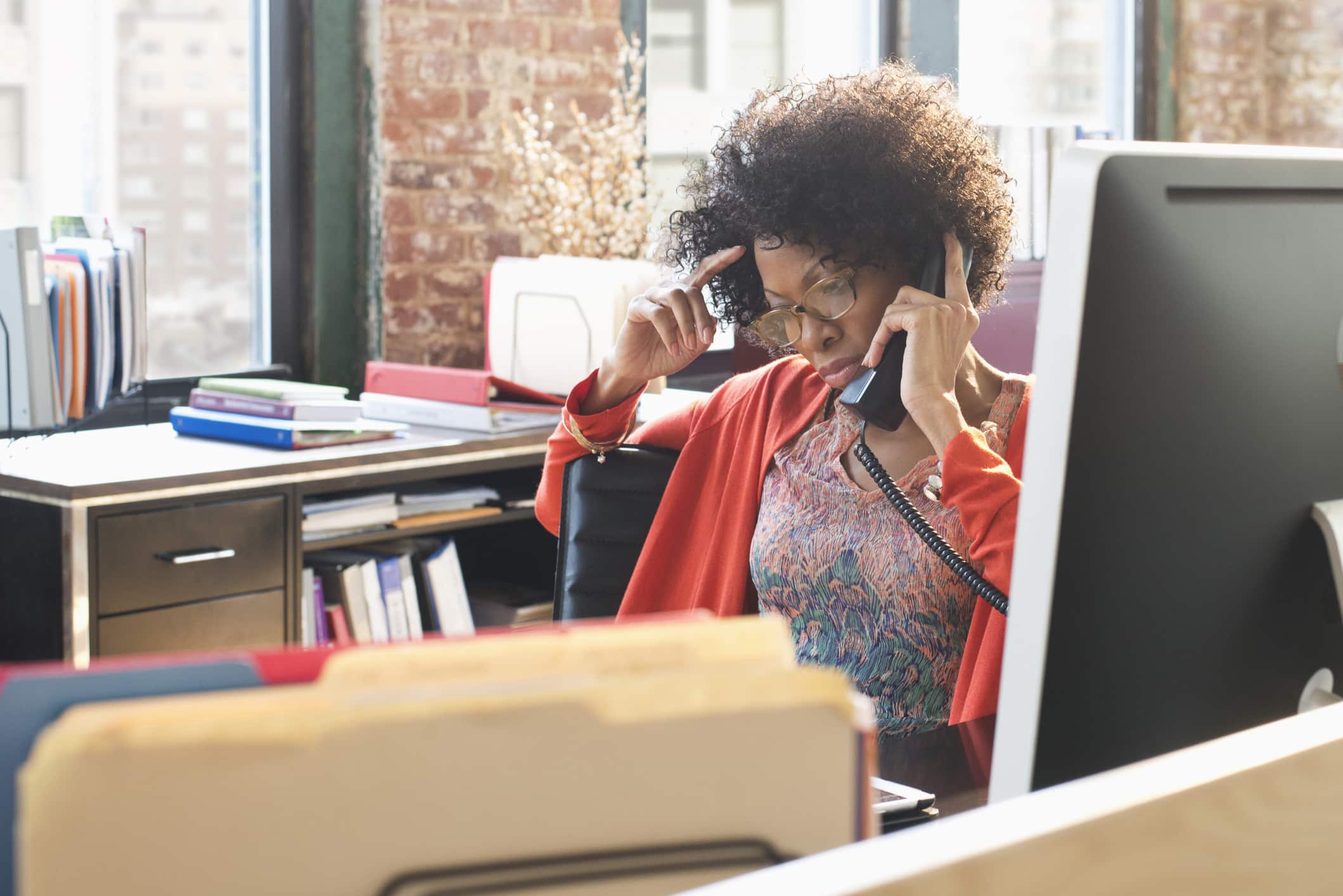 businesswoman-talking-on-telephone-at-office-distress-vs-eustress