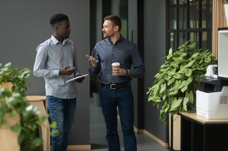 couple-of-colleagues-talking-what-to-say-during-exit-interview