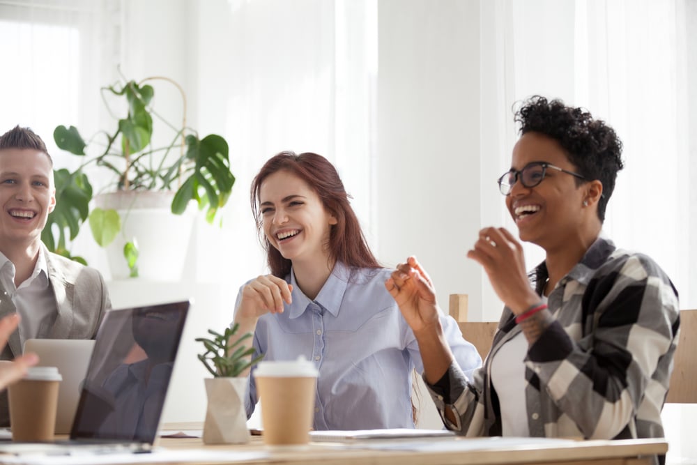 coworkers-sharing-a-laugh-at-the-office-types-of-work-relationships