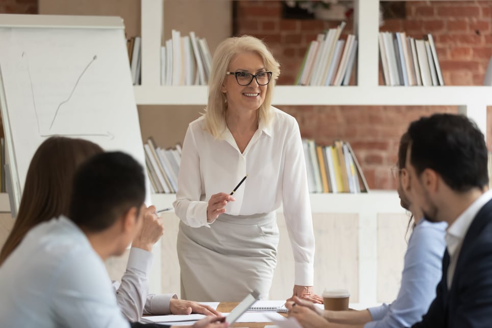 female-senior-manager-talkting-to-her-team-manager-vs-senior-manager