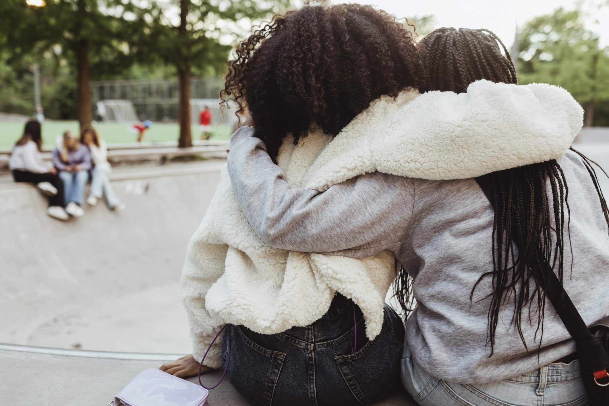 friends-hugging-each-other-stress-triggers