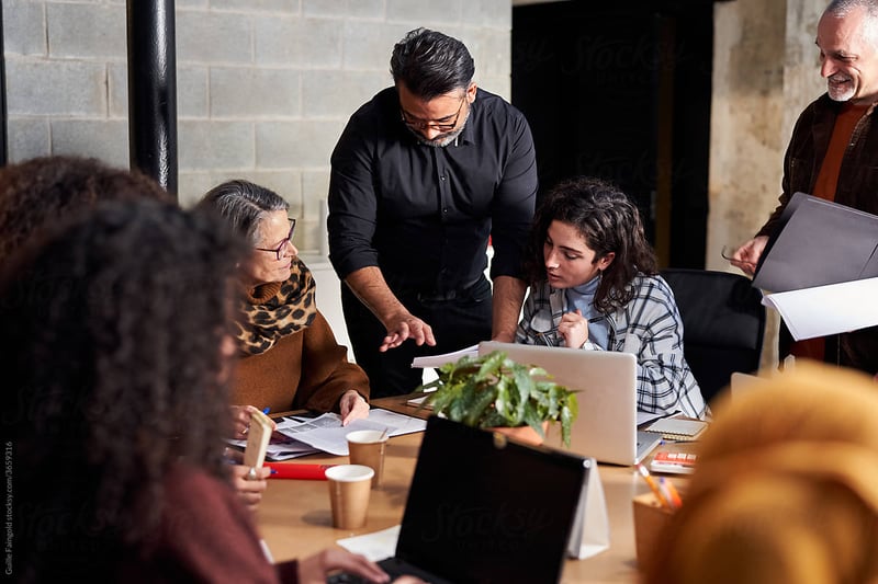 group-meeting-at-desk-executive-presence