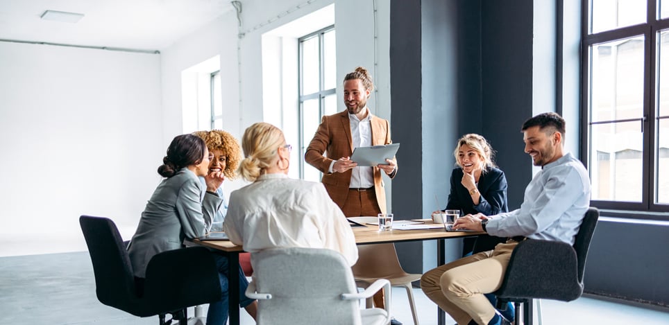 group-of-coworkers-in-a-meeting-smiling-working-as-a-contractor-vs-employee