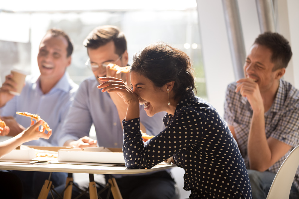 group-of-coworkers-laughing-how-to-get-over-embarrassment