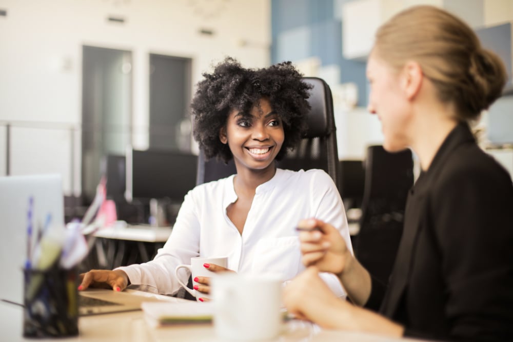 happy-coworkers-discussing-at-office-what-is-emotional-intelligence