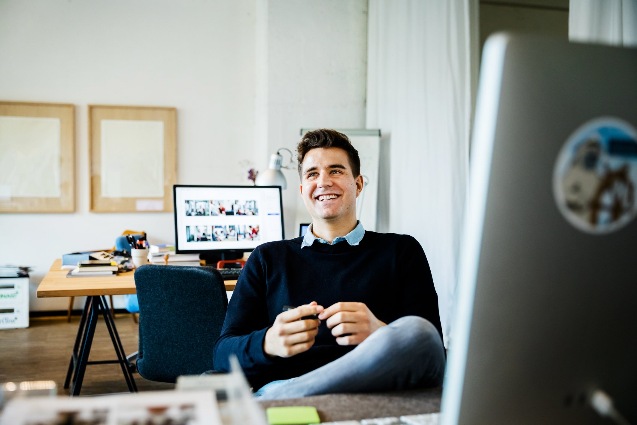 happy-employee-on-desk-passed-over-for-promotion