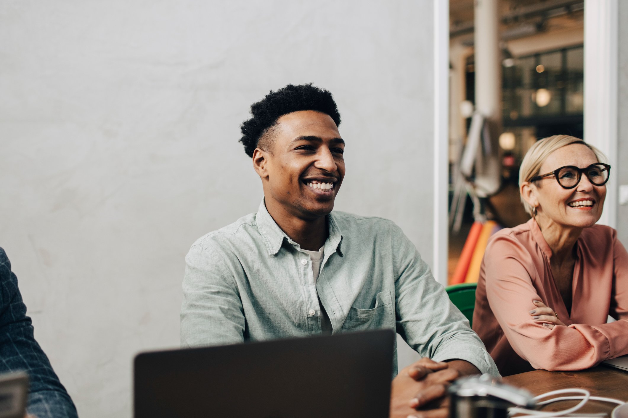 happy-male-professionals-sitting-by-female-how-to-find-a-job-you-love