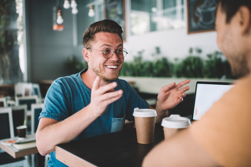 happy-man-at-coffee-shop-how-to-answer-what-are-your-weaknesses