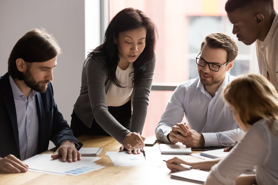 leader-explaining-something-to-her-team-self-compassion-at-work