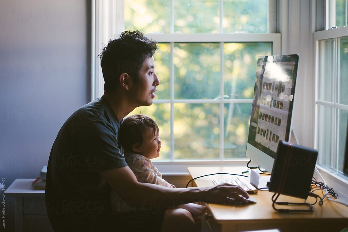 man-at-computer-with-baby-how-to-work-from-home