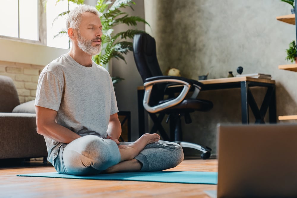 man-meditating-at-his-house-effects-of-low-resiliencegydF4y2Ba