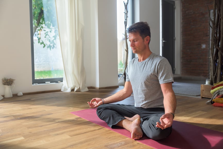 man-meditating-in-lotus-pose-mental-fitness