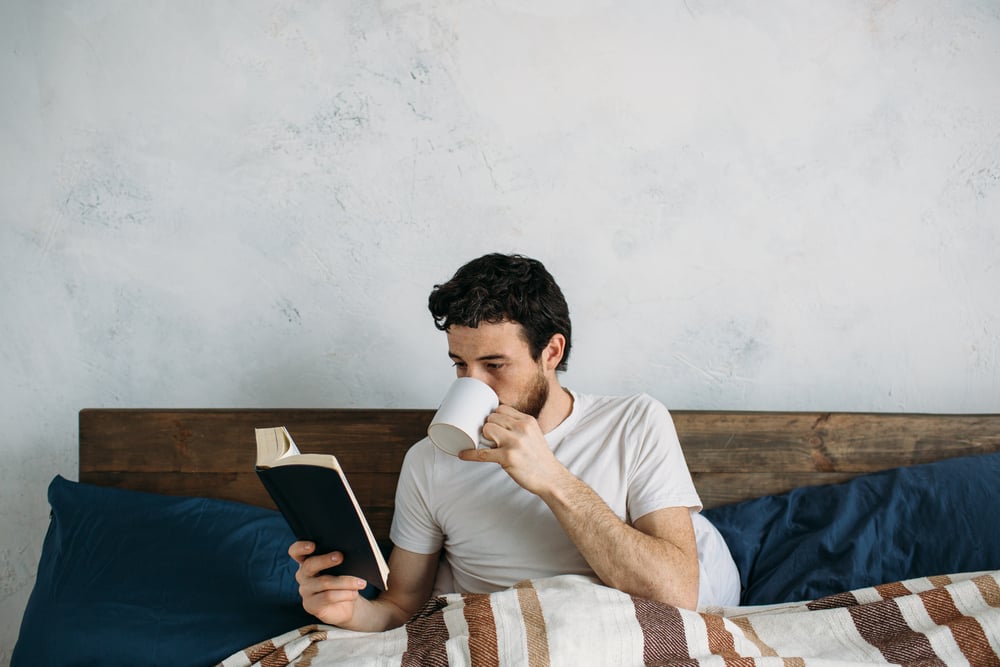 man-reading-and-drinking-coffee-self-care-for-caregivers