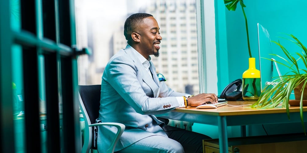 man-sitting-at-computer-desk-authentic-leadership