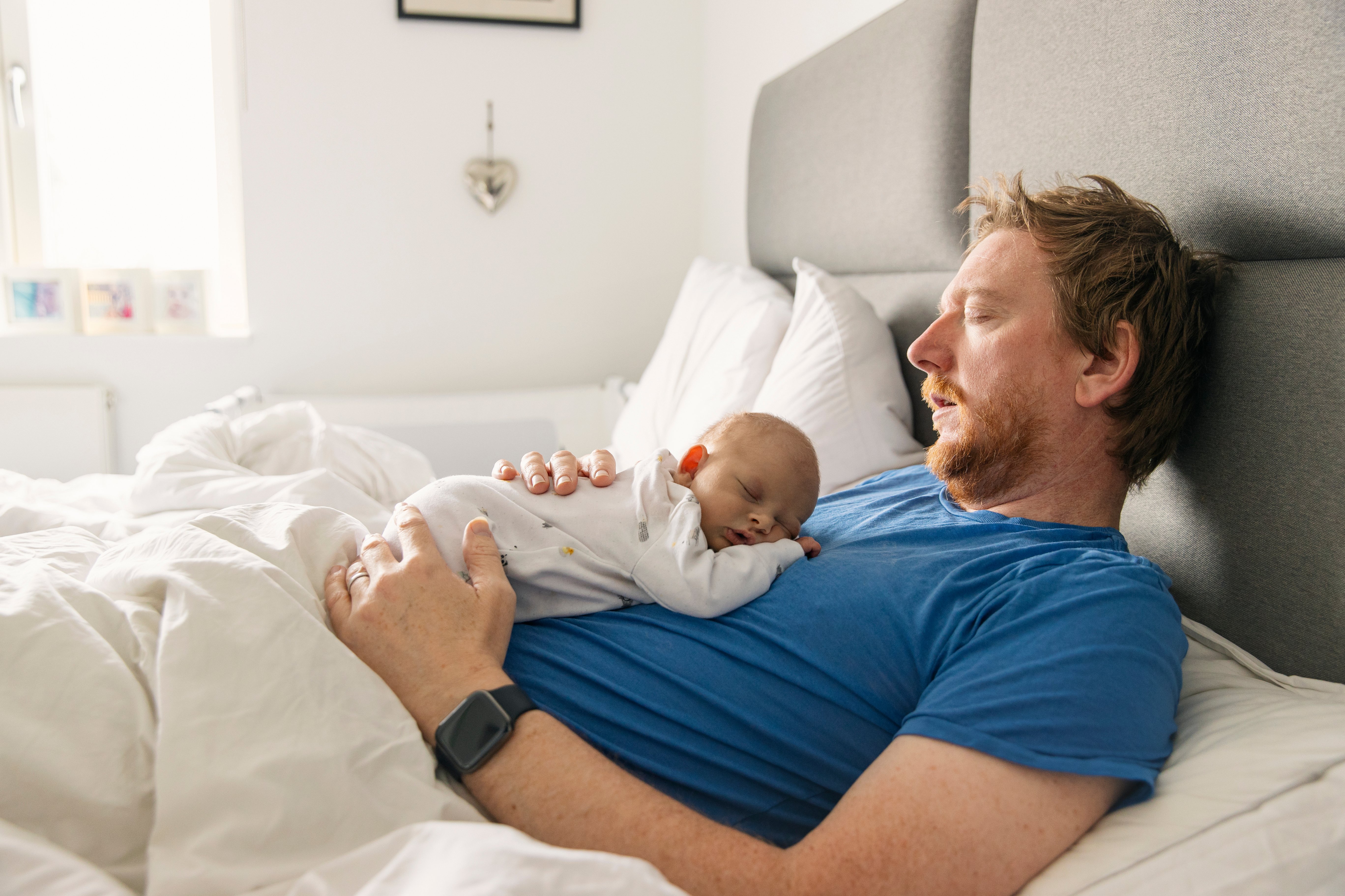 man-sleeping-with-baby-sleep-hygiene