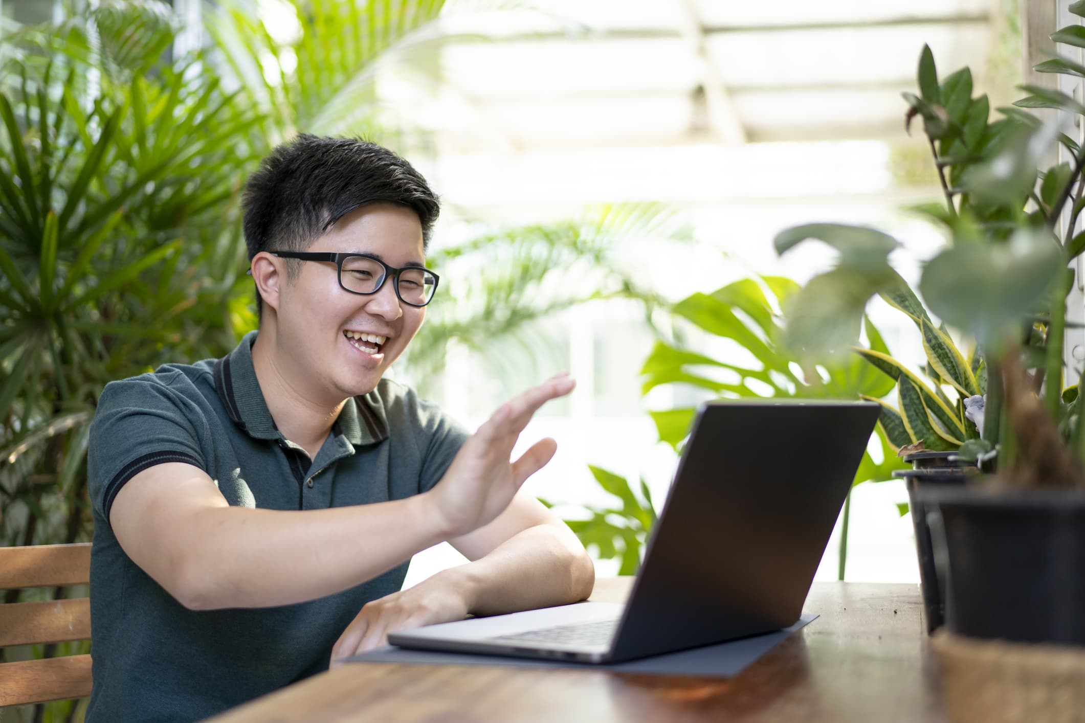 man-waving-at-computer-email-etiquette