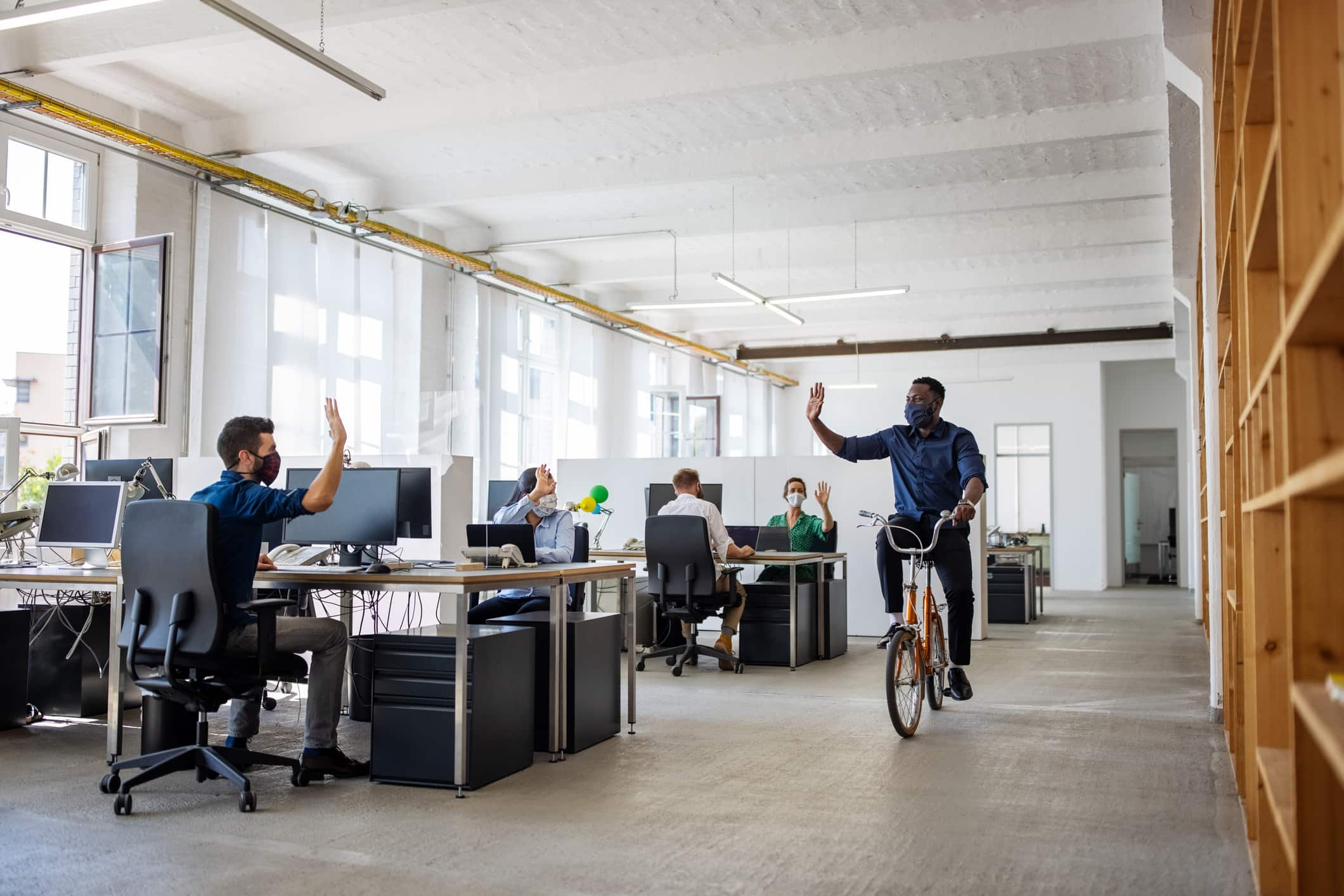 man-waving-goodbye-while-riding-on-a-bike-can-i-just-quit-my-job