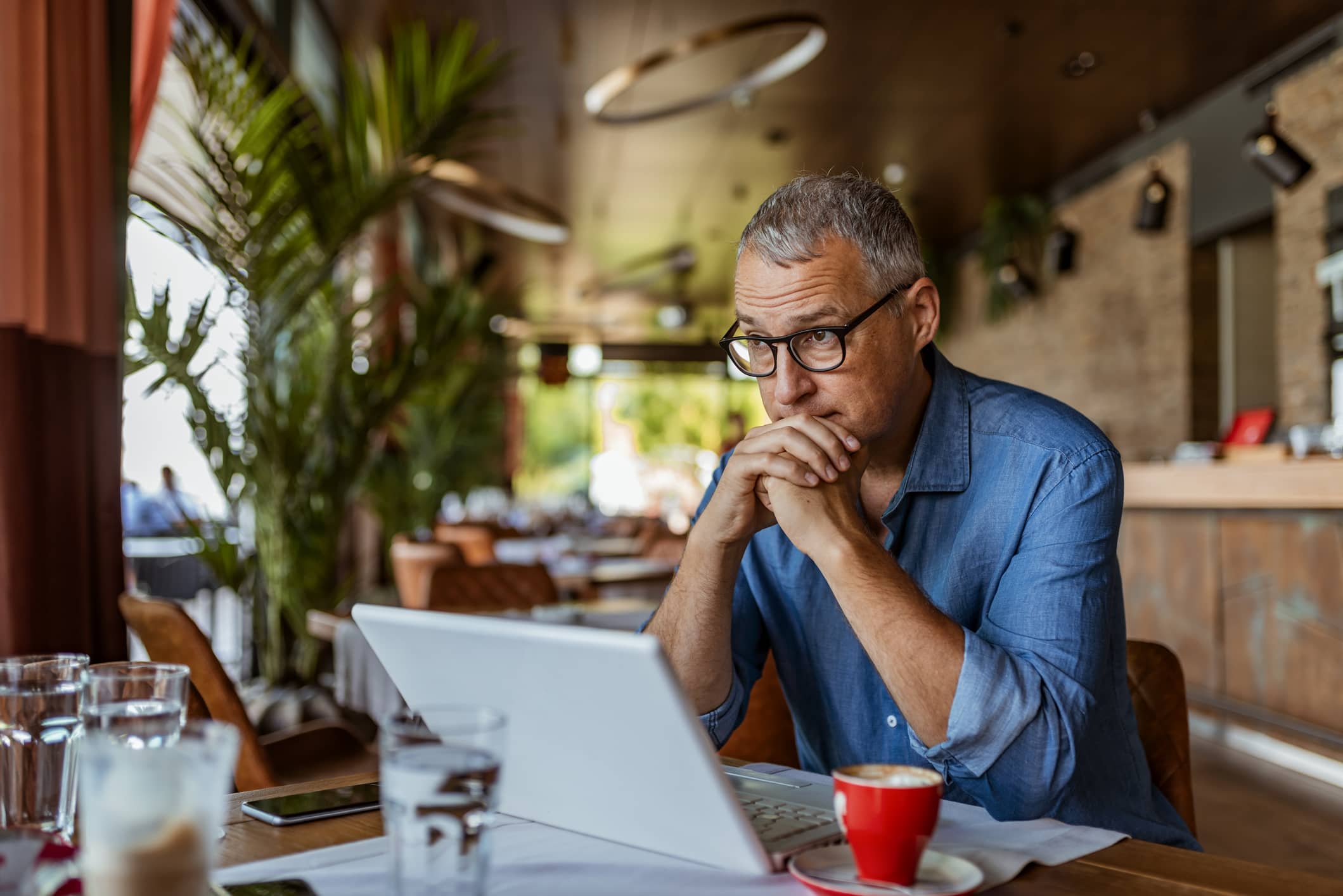 mature-man-looking-pensive-at-restaurant-how-to-deal-with-rejection