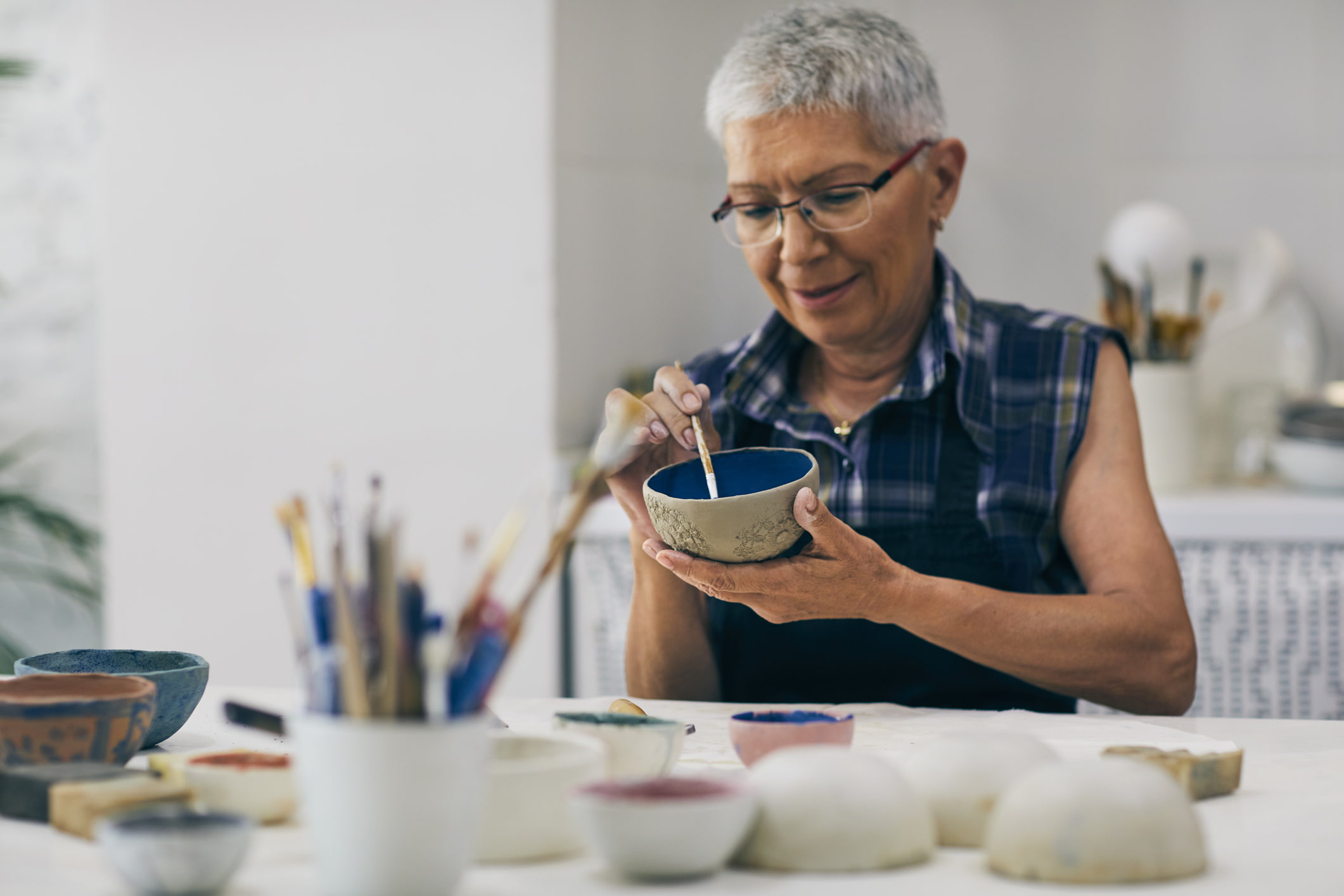 senior-woman-practicing-pottery-what-are-limiting-beliefs