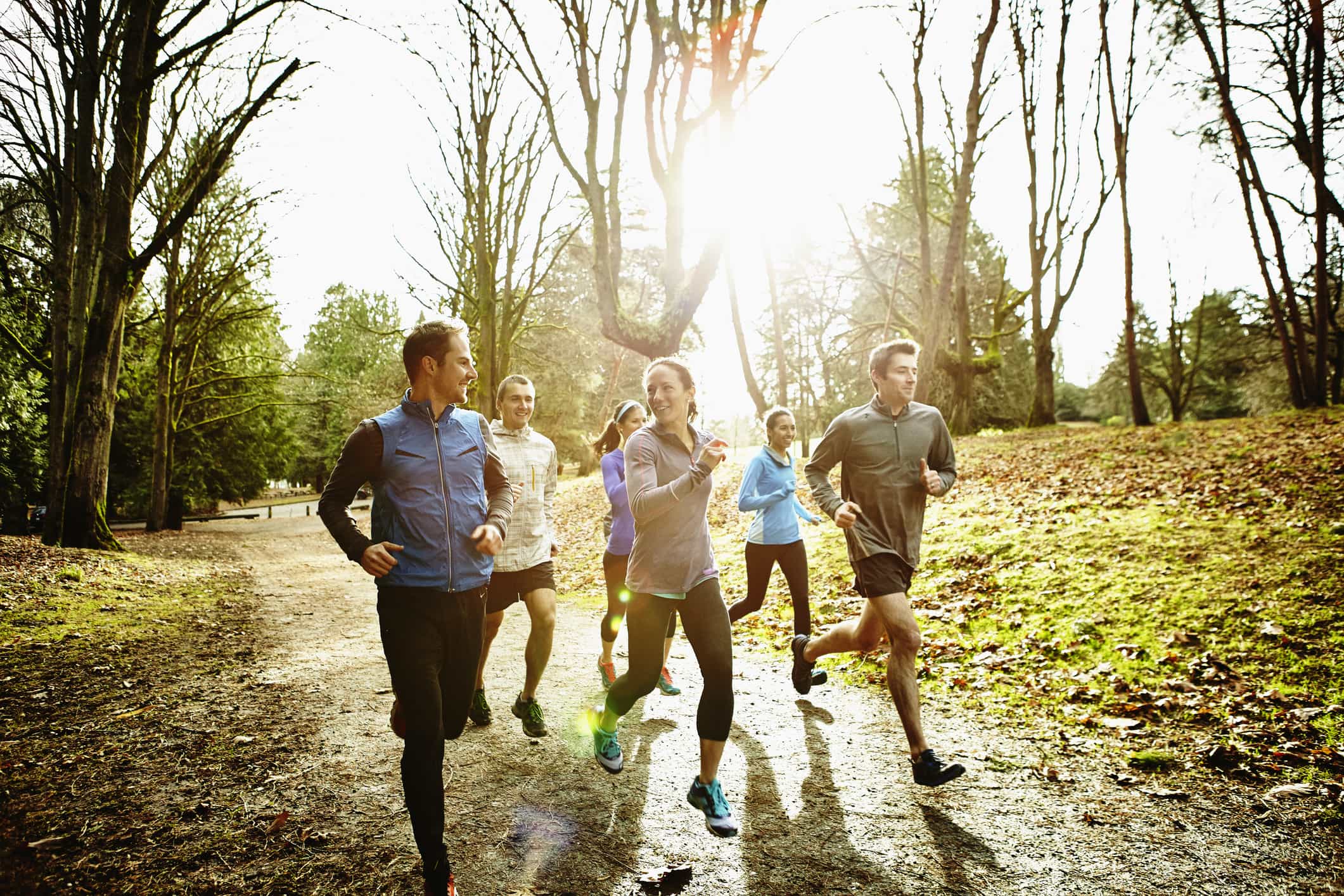 smiling-friends-running-together-in-park-eustress-characteristics