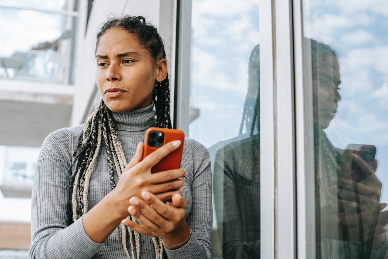 stressed-woman-using-phone-cell-phone-addiction