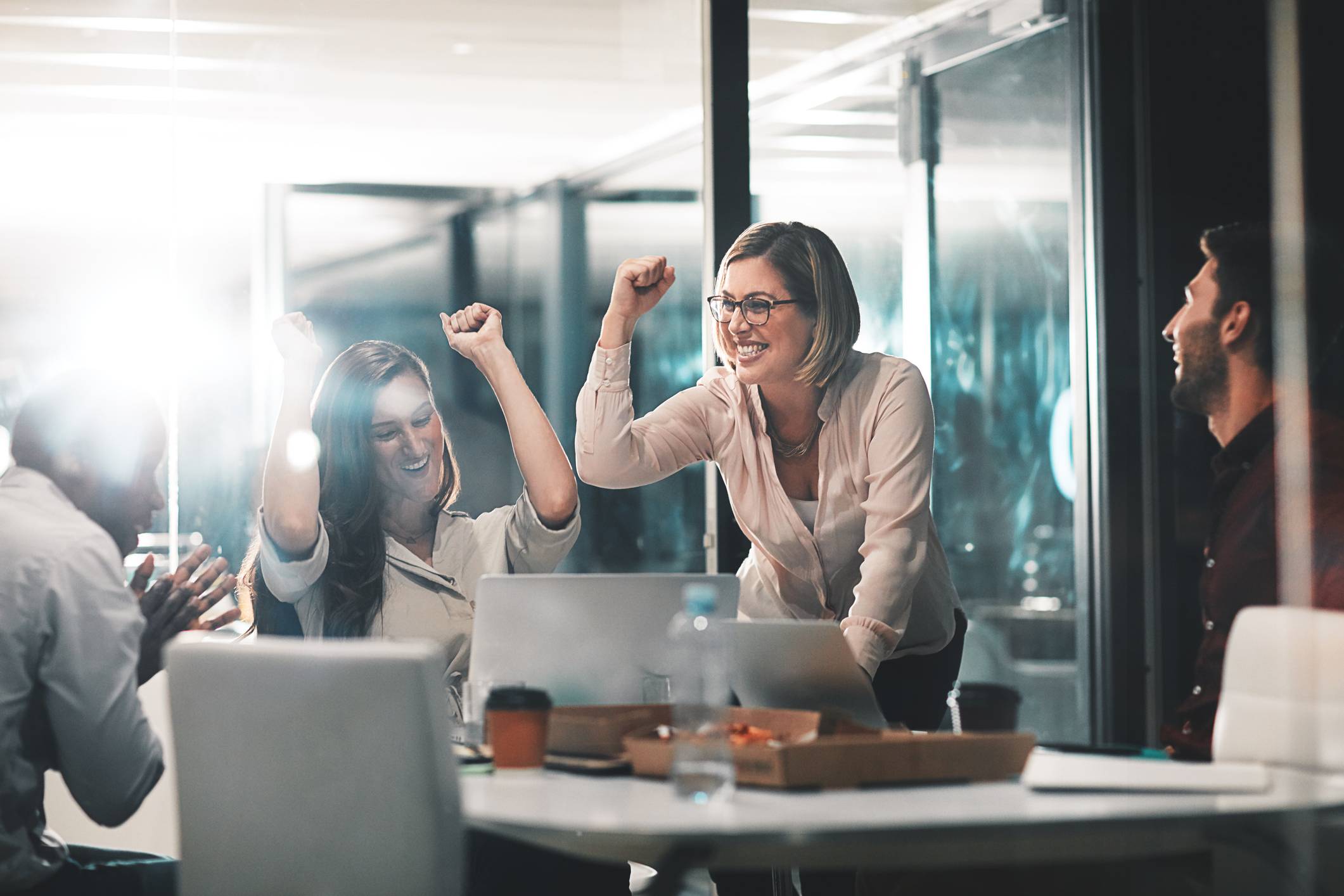 team-celebrating-at-job-meeting-soft-management-skills