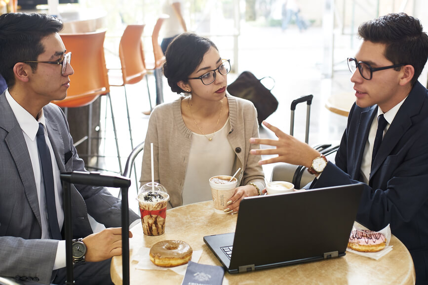 three-colleagues-talk-over-coffee-and-donuts-rational-persuasion