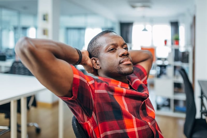 man-sitting-in-a-chair-thinking-upskilling