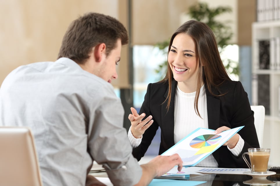 woman-explaining-a-chart-to-workmate-and-smiling-job-hopping-syndrome