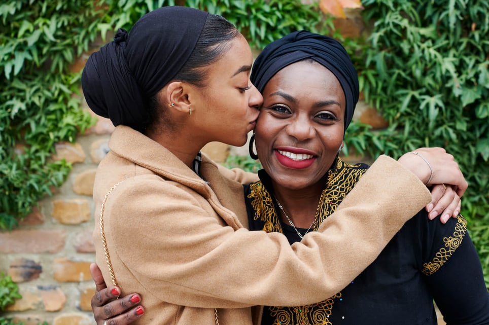 woman-kissing-mother-on-cheek-emotional-health