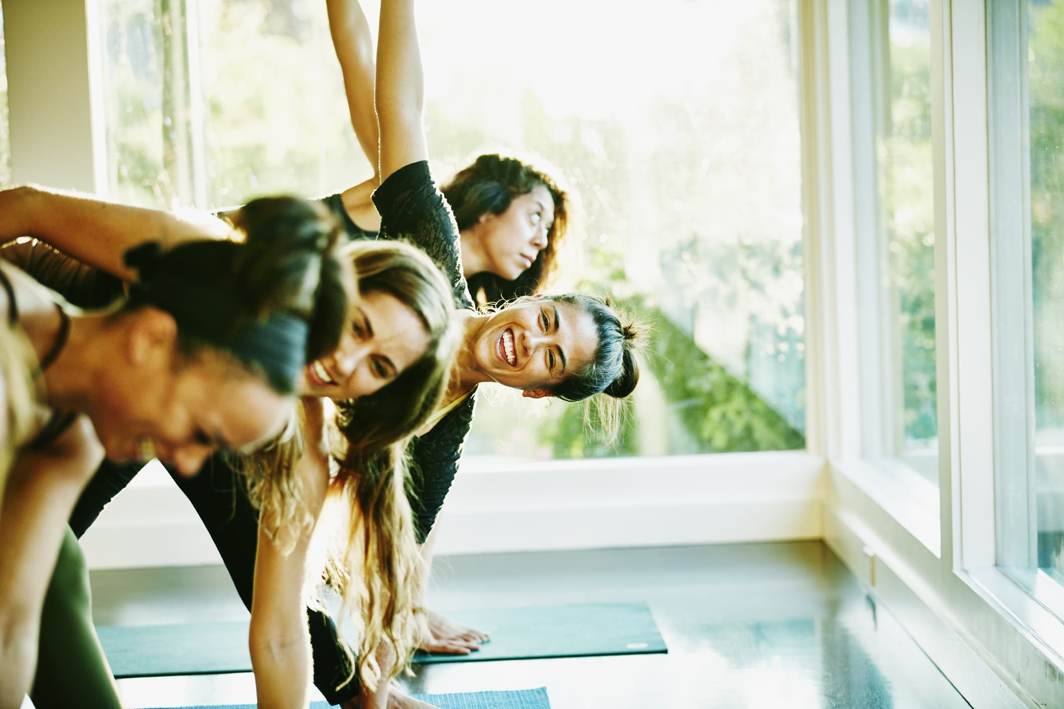 woman-laughing-while-exercising-benefits-of-eustress