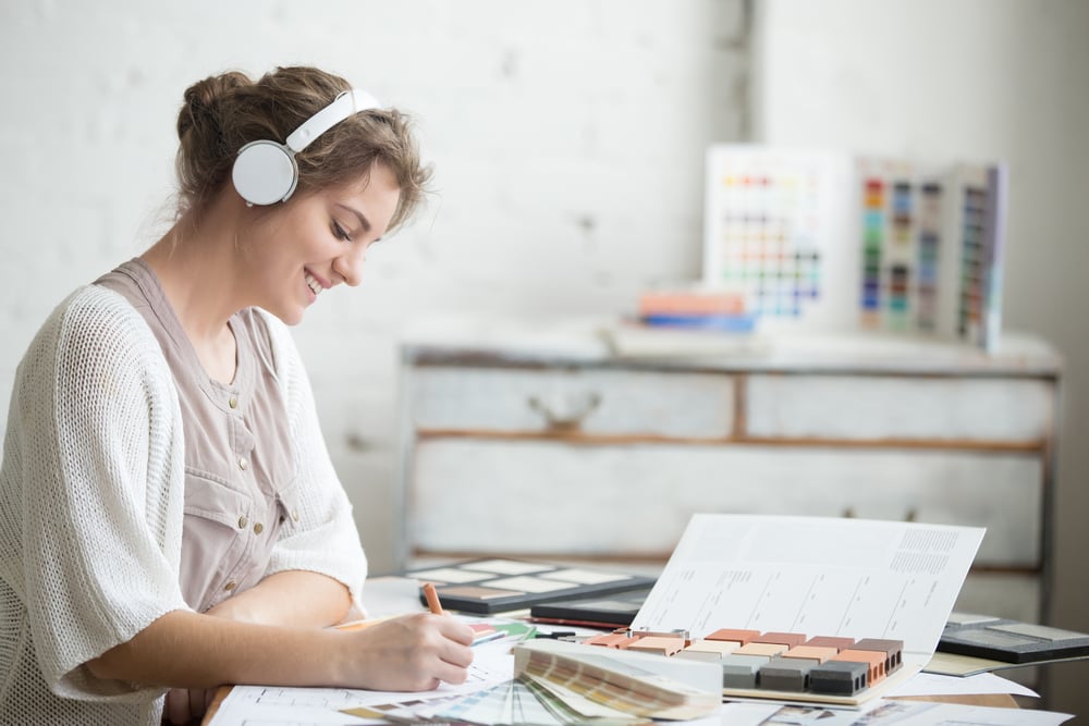 woman-listening-music-while-picking-paint-colors-how-to-rest