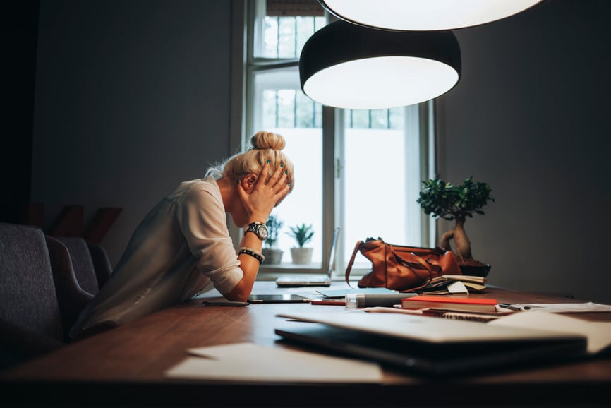 woman-sitting-with-head-on-her-hands-upset-what-is-failure