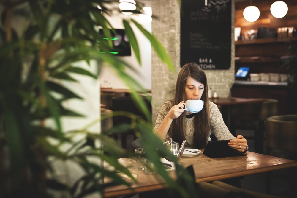 woman-working-at-coffee-shop-self-care-and-work-life-balance