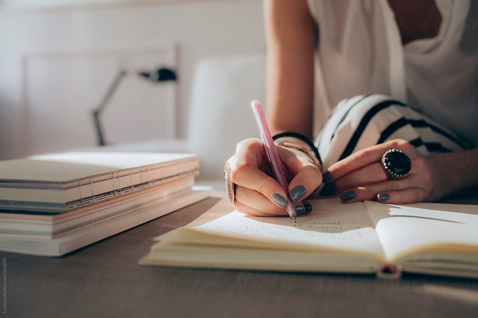 woman-writing-hands-life-planning