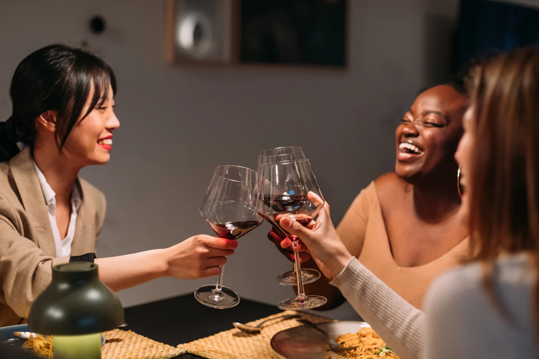 women-toasting-drinking-wine-together-reward-yourself