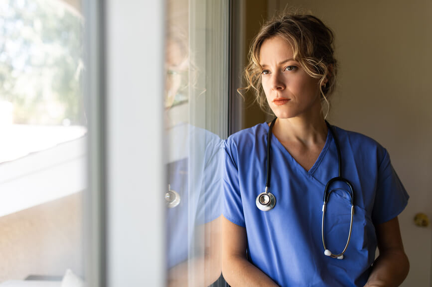 worried-nurse-looks-out-window-types-of-stress