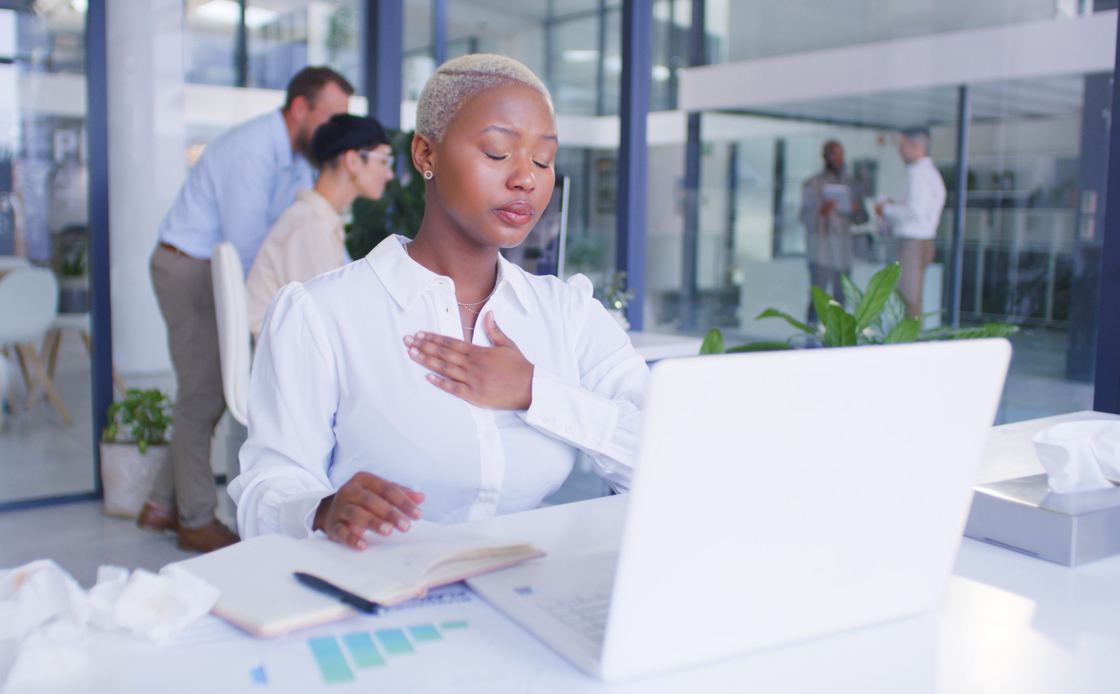 young-businesswoman-feeling-unwell-while-using-a-laptop-in-a-modern-office-anger-management-strategies