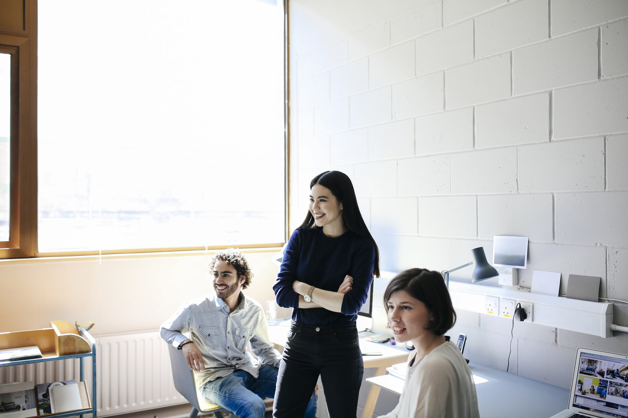 young-man-and-women-laughing-in-studio-space-what-is-an-internship