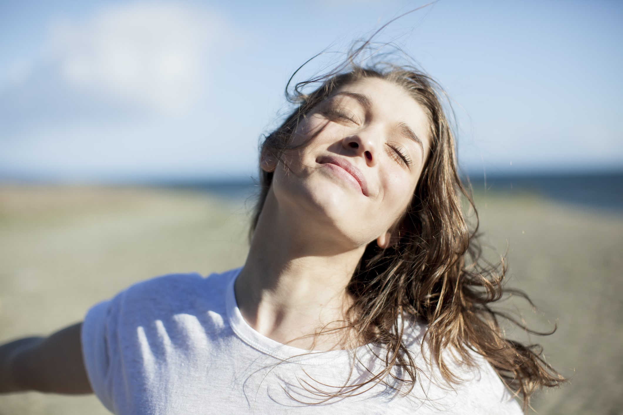 young-woman-with-eyes-closed-smiling-how-to-start-over-in-life